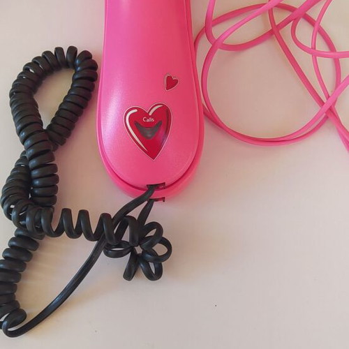 Pink telephone used with cord