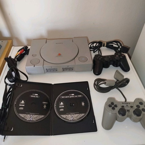 PlayStation 1 used with cables, two demos and two controllers