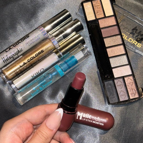 Cosmetics pack like new with lip gloss, eyeshadow palette, brow gel and lipstick