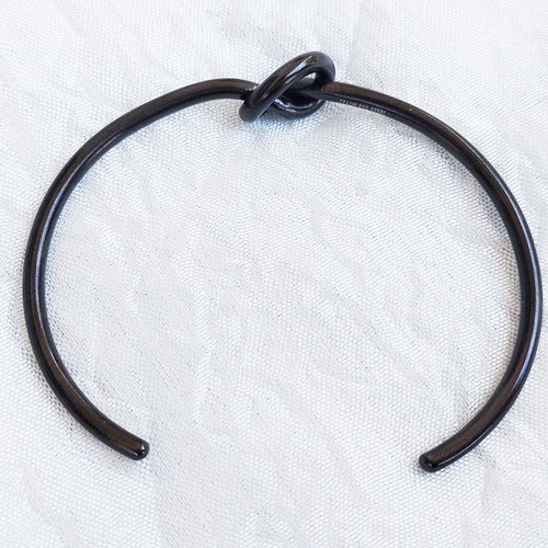 Tumi stainless steel knot bracelet black, like new