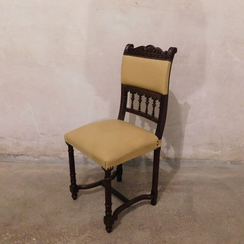 Pair of carved wooden chairs with leather seat like new, about 100 years old