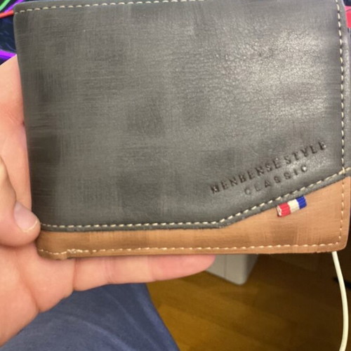 Wallet used, brown with fabric tear at cash compartment