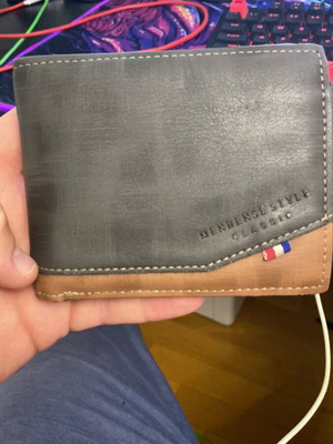 Wallet used, brown with fabric tear at cash compartment