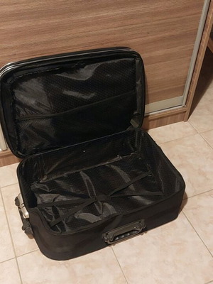 Travel suitcase used, black, lightweight with expandable zipper