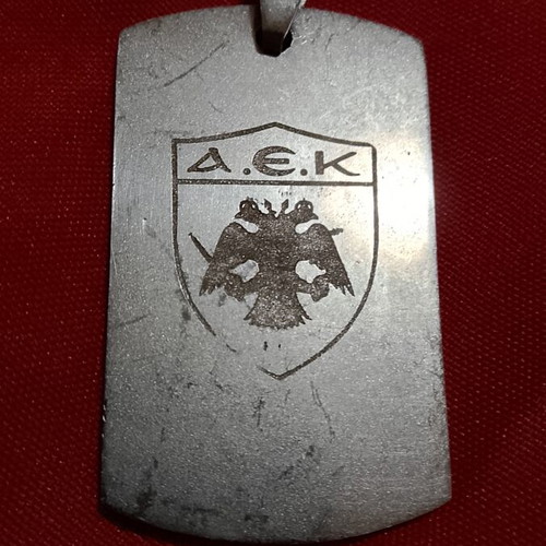 AEK stainless steel pendant with engraved emblem, like new