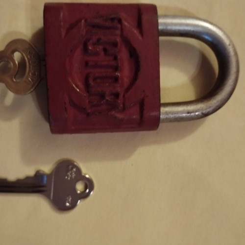 Old padlock used with key and skeleton key