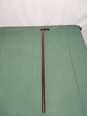 Wooden walking cane used, dark brown color
