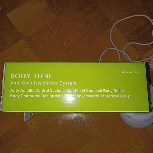 Body Tone massage machine like new with charger and cable