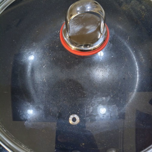 Deep baking pan with lid used, steam vent