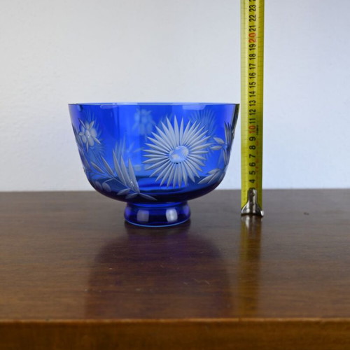 Blue crystal bowl used with cut glass sunflower and leaf design
