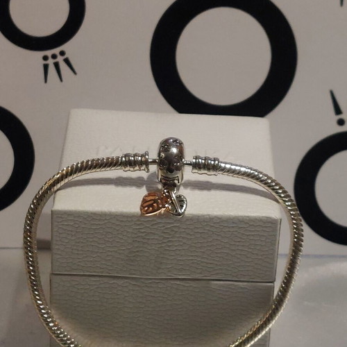 Pandora bracelet size 18 with round clasp and two leaf charms