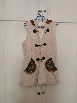 Fur vest used, pale pink with ethnic details, size L
