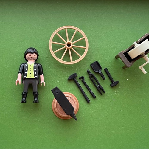Playmobil blacksmith figure with whetstone wheel, cart wheel, anvil set