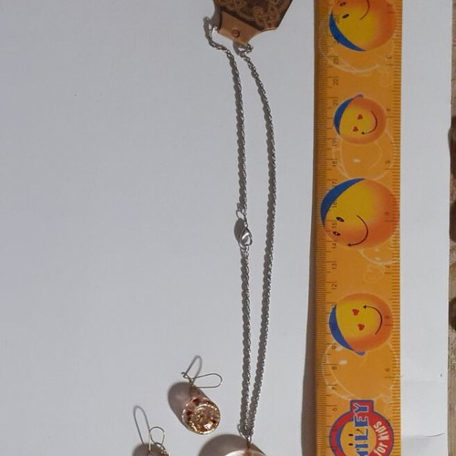 Two sets of handmade pendants and earrings, multicolor