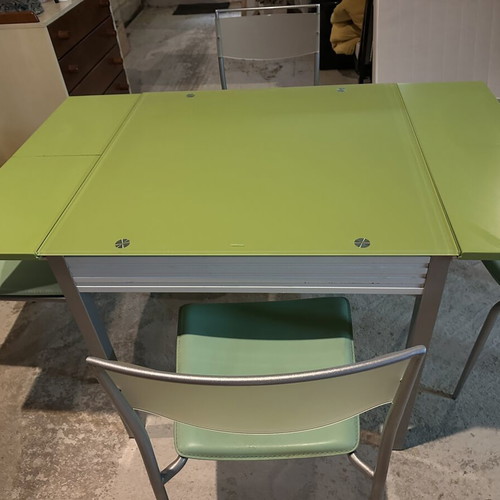 Glass dining table with extension and 4 used chairs, light green