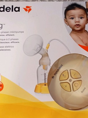 Medela breast pump with 2-Phase Expression® technology like new