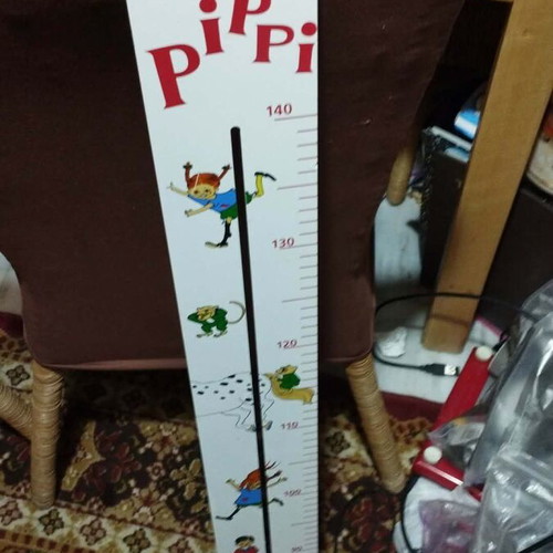 Wooden wall height chart with Pippi Longstocking theme used
