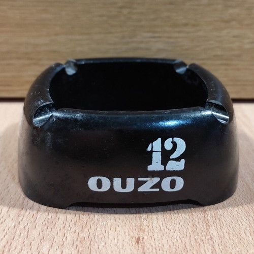 Ouzo 12 square black plastic ashtray used