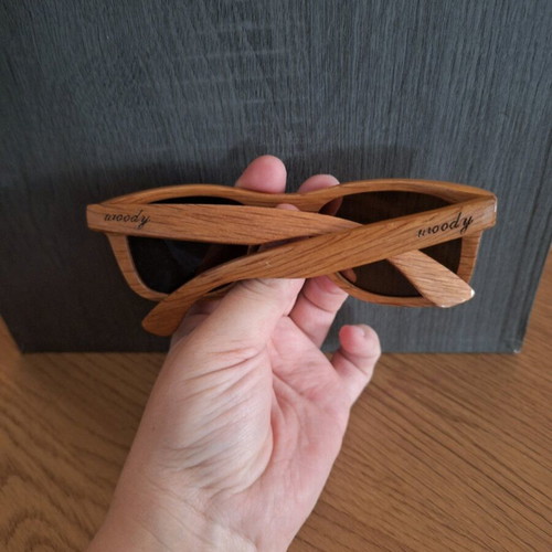 Woody wooden sunglasses used, with arm needing screwing