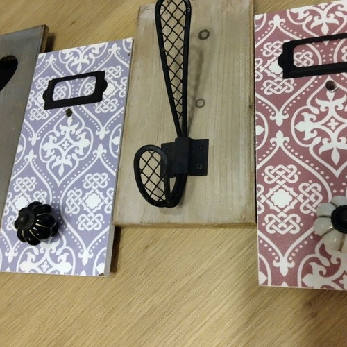 Decorative wall hanger used with wooden base and metal hooks