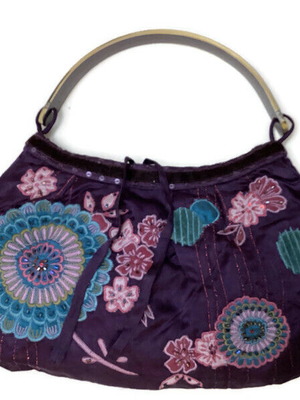 Purple appliqued handbag