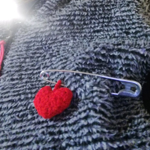 Knitted hanging red hearts like new