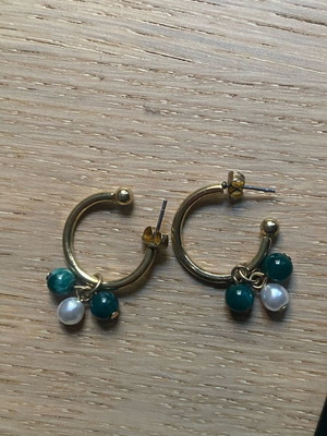 Earrings used with gold, green and white beads