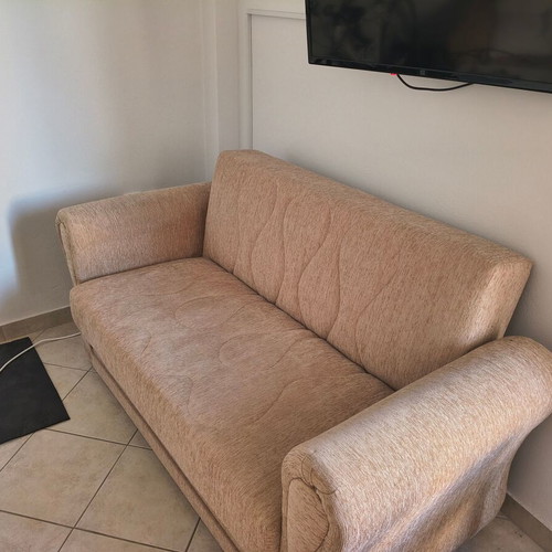 Two-seater sofa bed, beige fabric with storage