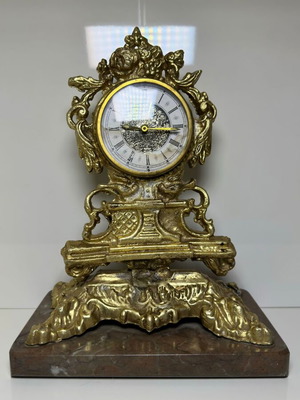Vintage metal table clock baroque style with marble base used