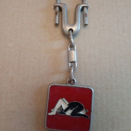 Vintage keychain like new with schematic sexual position design, red