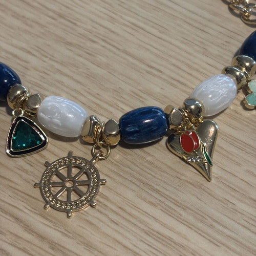 Statement necklace with blue and gold sea charms