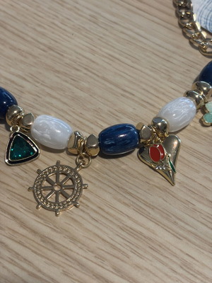 Statement necklace with blue and gold sea charms