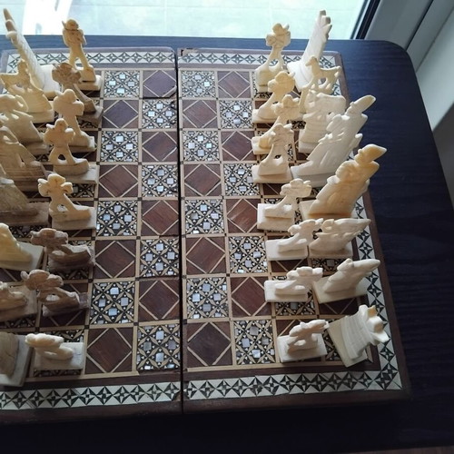 Handmade chess with mother-of-pearl and ancient Egyptian figures used