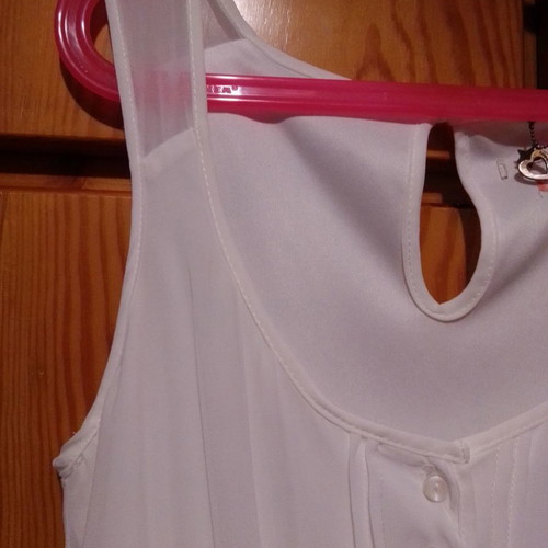 Two white dresses used, sizes 12-14 for girls