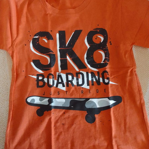 T-shirt orange for boy 10Y like new with skateboard print