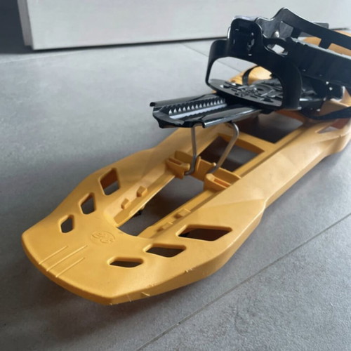 Sneka snowshoes used for hiking with metal crampons