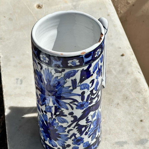 Vintage handmade ceramic cup and decorative Delft style jug used, blue floral