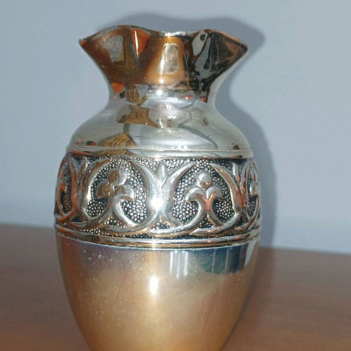 Decorative metal vase used, silver color with embossed design