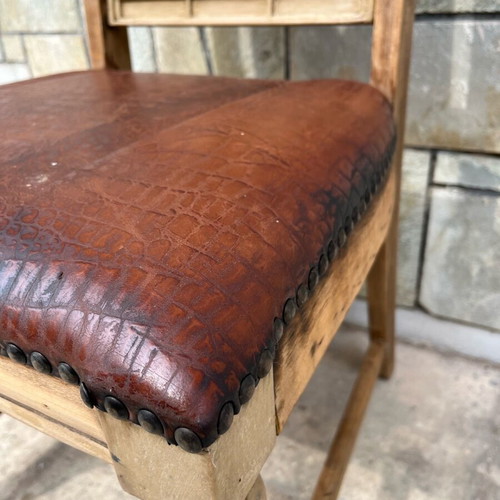 Skyrian carved chair used with replaced leather