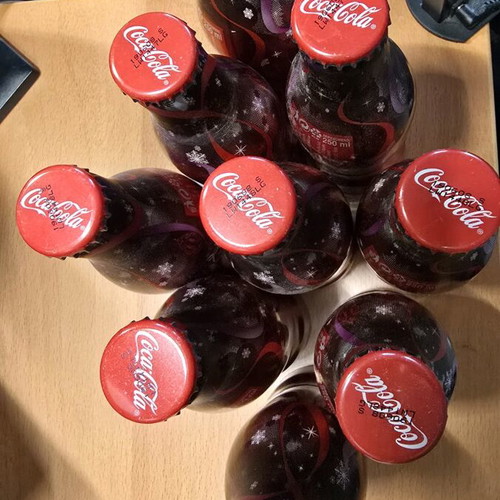 Coca Cola bottles new, festive set of 9 aluminum 250ml