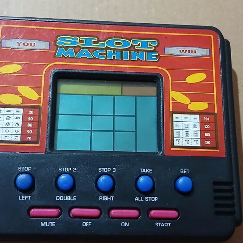 Vintage handheld electronic game slot machine like new
