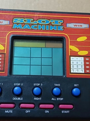 Vintage handheld electronic game slot machine like new