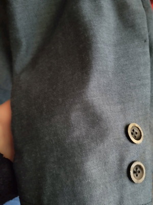Tailored spring jacket used, hand-stitched