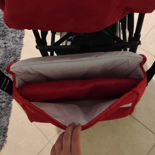Kiddo Smart Deluxe stroller used with footmuff and changing bag, red