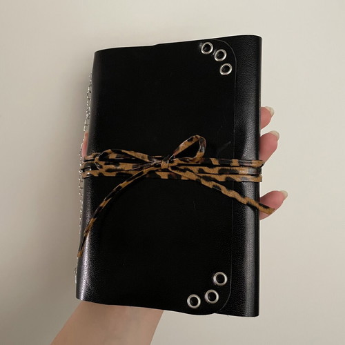 Handmade leather journal with customizable inserts and charm