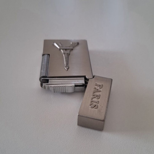Gas lighter with Eiffel Tower design, like new