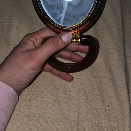 Hand mirror with two sides like new for magnification and reduction