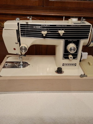 Janone portable sewing machine used with accessories