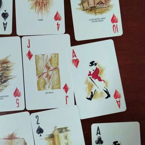 Johnnie Walker collectible playing cards laminated in metal box like new