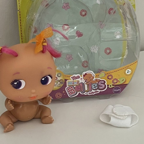 The Bellies Mini Yummy doll used, pink hair, orange bows